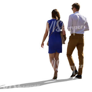 neatly dressed backlit couple walking side by side