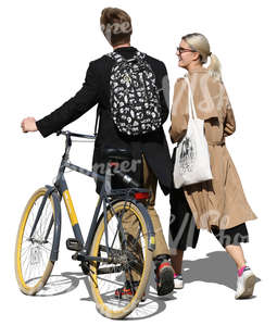 man with a bike walking with a blonde woman