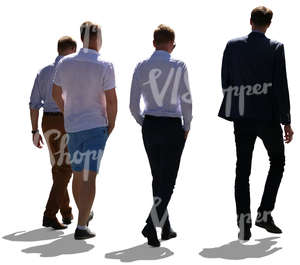 backlit group of four men walking