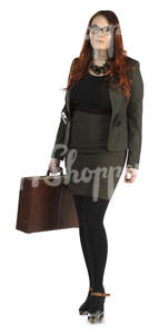 businesswoman walking with a briefcase in her hand