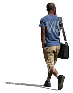 black man in shorts walking 