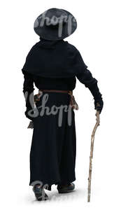 man in a black medieval costume walking