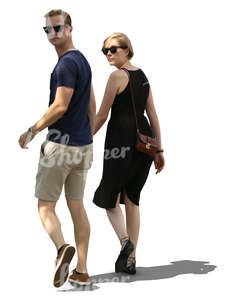 couple walking hand in hand in tree shade