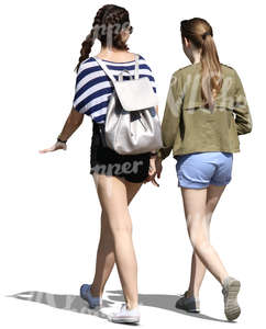 two teenage girls walking and talking
