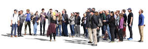 big group of people standing and listening to their guide