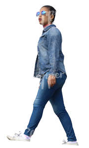 black woman in denim clothing walking seen from below