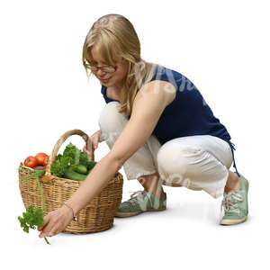 cut out woman picking herbs in the garden