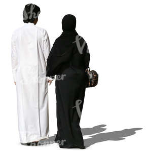 arab couple in traditional clothes walking hand in hand