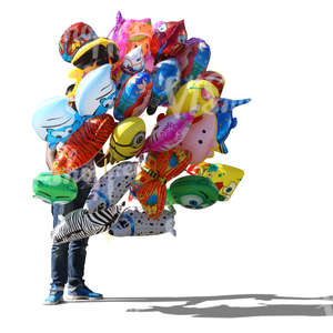 man standing and selling balloons