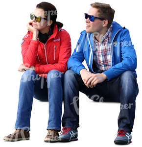 man and woman with sunglasses sitting and looking at smth