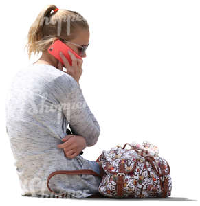 girl sitting and talking on the phone
