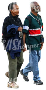 elderly black couple walking hand in hand