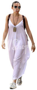 woman in a long white summer dress walking