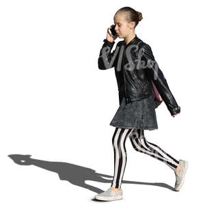 young girl in striped leggings walking and talking on the phone