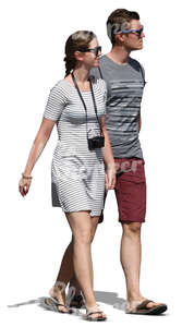 young man and woman walking hand in hand in summer