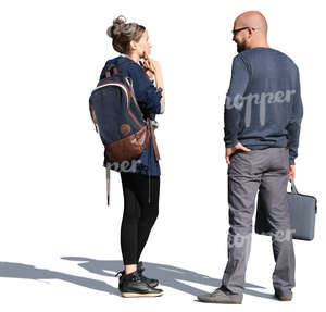 man and woman standing on the street and talking