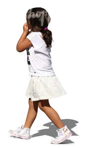 young girl with dark hair walking and eating an apple