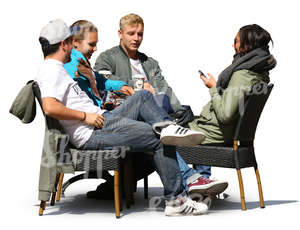 group of young people sitting in a cafe and drinking coffee