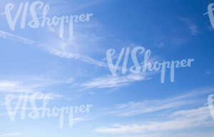 blue sky with few thin clouds