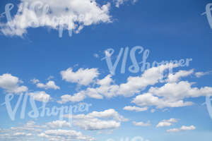 daytime sky with white cumulus clouds