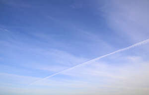 blue sky with thin layer of clouds