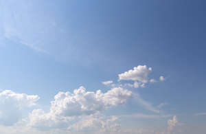 daytime sky with few cumulus clouds