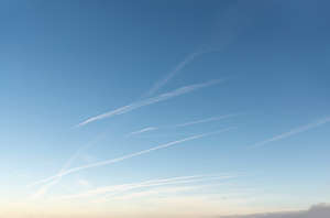 clear evening sky with contrails