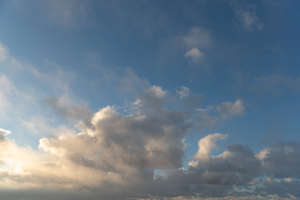 evening sky with sun behind the clouds