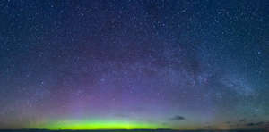 starry night sky with northern light