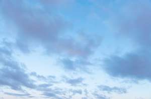 pale blue sky with thin clouds