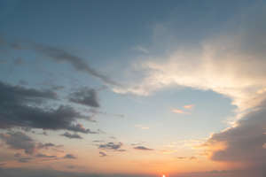 sunset sky with bright orange sun