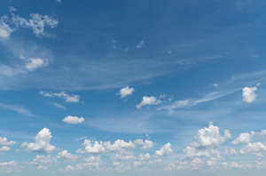 daytime sky with small fluffy clouds