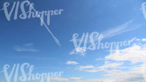 blue sky with clouds and contrails