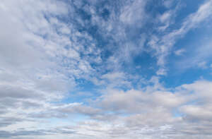 daytime sky with many scattered clouds