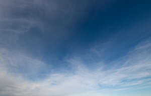 daytime sky with few thin clouds