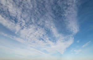 blue sky with thin white clouds