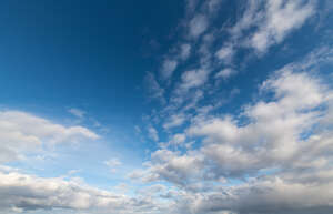 deep blue daytime sky with some white cloud areas