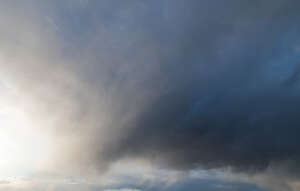 sky with grey clouds and sun