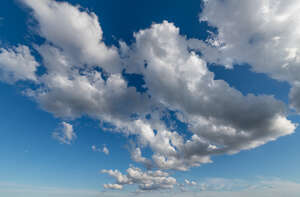 daytime sky with clustered clouds