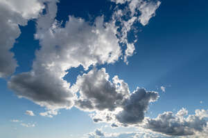 sky image with sun behind clouds