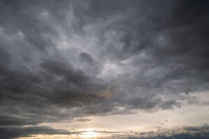 sunset with large grey clouds