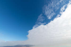 blue sky with one large white cloud