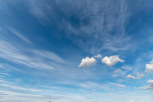 daytime with few tiny white clouds