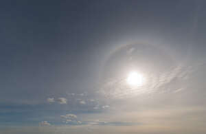 daytime sky with sun and halo