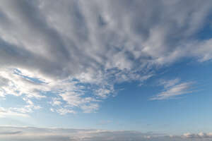 daytime sky with large white cloud