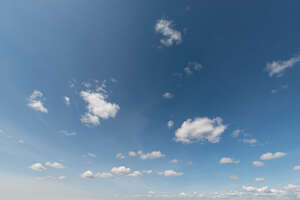 cut out blue daytime sky with few little cute clouds