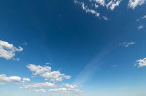 deep blue sky with tiny clouds