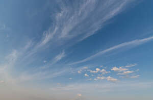 daytime sky with thin long clouds