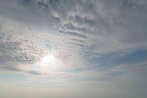 daytime sky covered with thin layer of white clouds