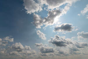 daytime sky with sun partially visible